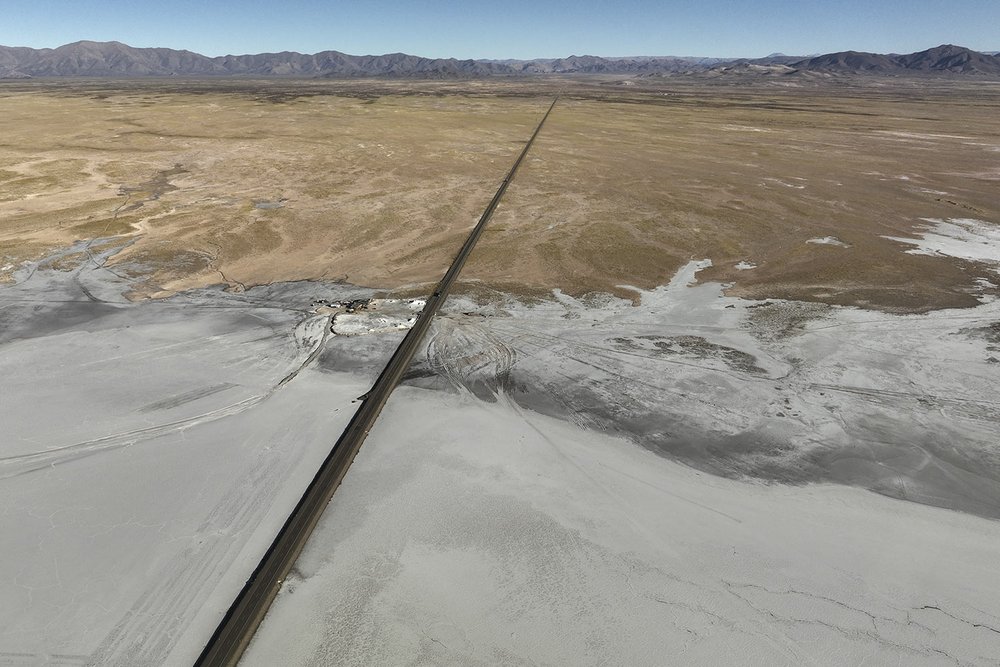  A highway crosses the Salinas Grandes salt flats in the northern Argentine province of Jujuy on April 25, 2023. (AP Photo/Victor R. Caivano) 