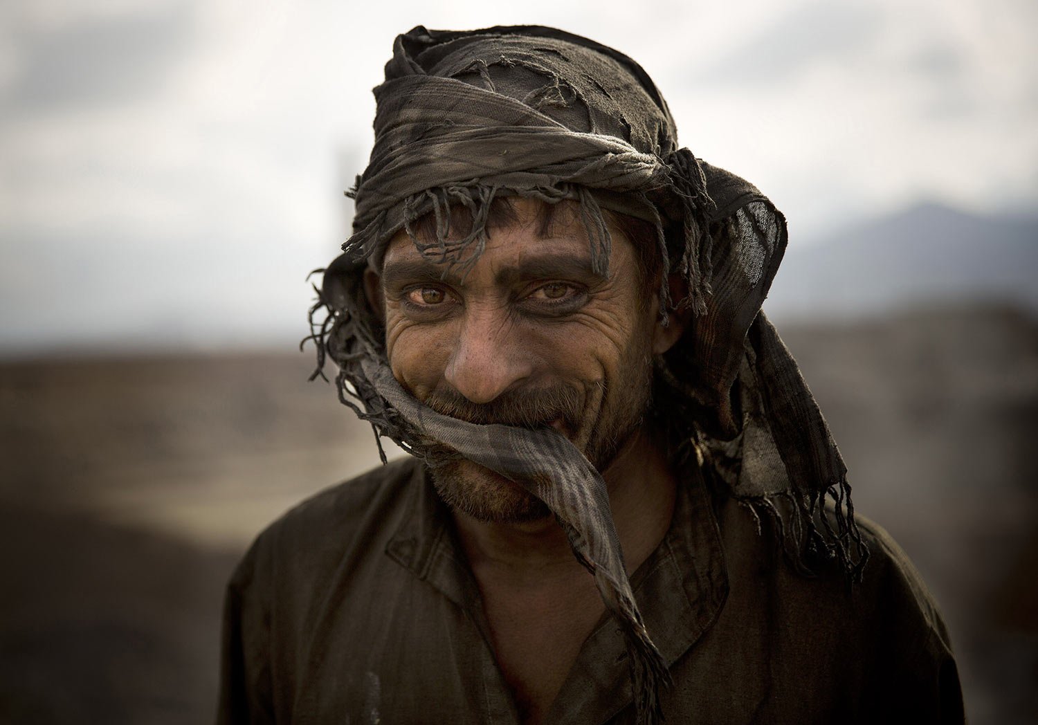  Day laborer Zekrullah, 23, takes a break from preparing brick kilns at a factory on the outskirts of Kabul, Afghanistan, Thursday, Nov 7, 2013. (AP Photo/Anja Niedringhaus) 