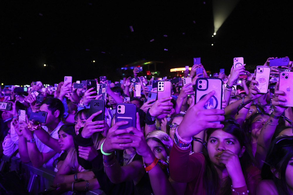  Music fans watch Mexican singer Junior H perform at the Vive Latino music festival in Mexico City, March 17, 2024. (AP Photo/Ginnette Riquelme) 