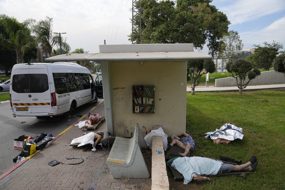  The bodies of civilians killed by Palestinian militants lie covered in Sderot, Israel, on Saturday, Oct. 7, 2023. Photo by Ohad Zwigenberg 