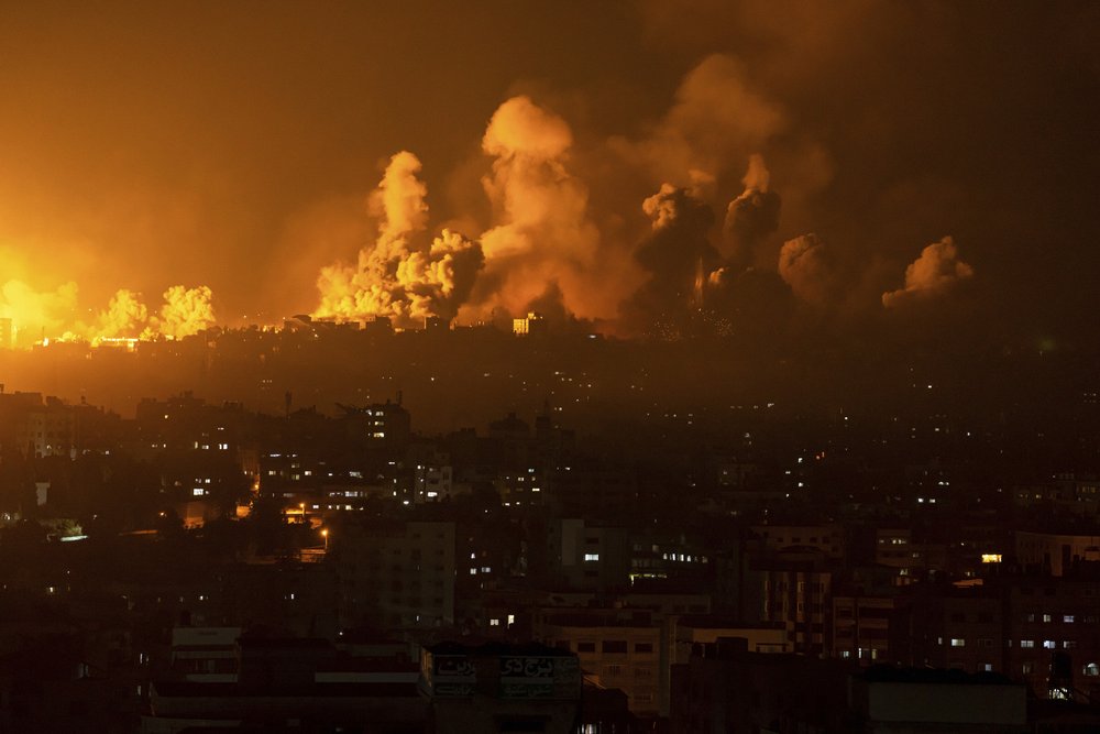  Fire and smoke rise following an Israeli airstrike in Gaza City, Sunday, Oct. 8, 2023. Photo by Fatima Shbair 