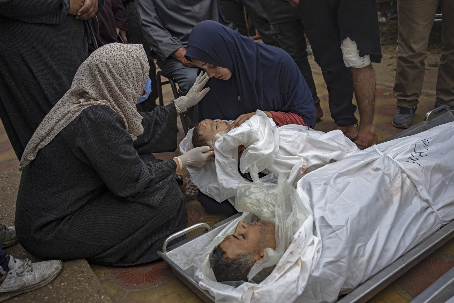  A Palestinian woman mourns her child and her husband killed in an Israeli army bombardment of the Gaza Strip, outside the hospital in Khan Younis, Tuesday Dec. 5, 2023. Photo by Fatima Shbair 