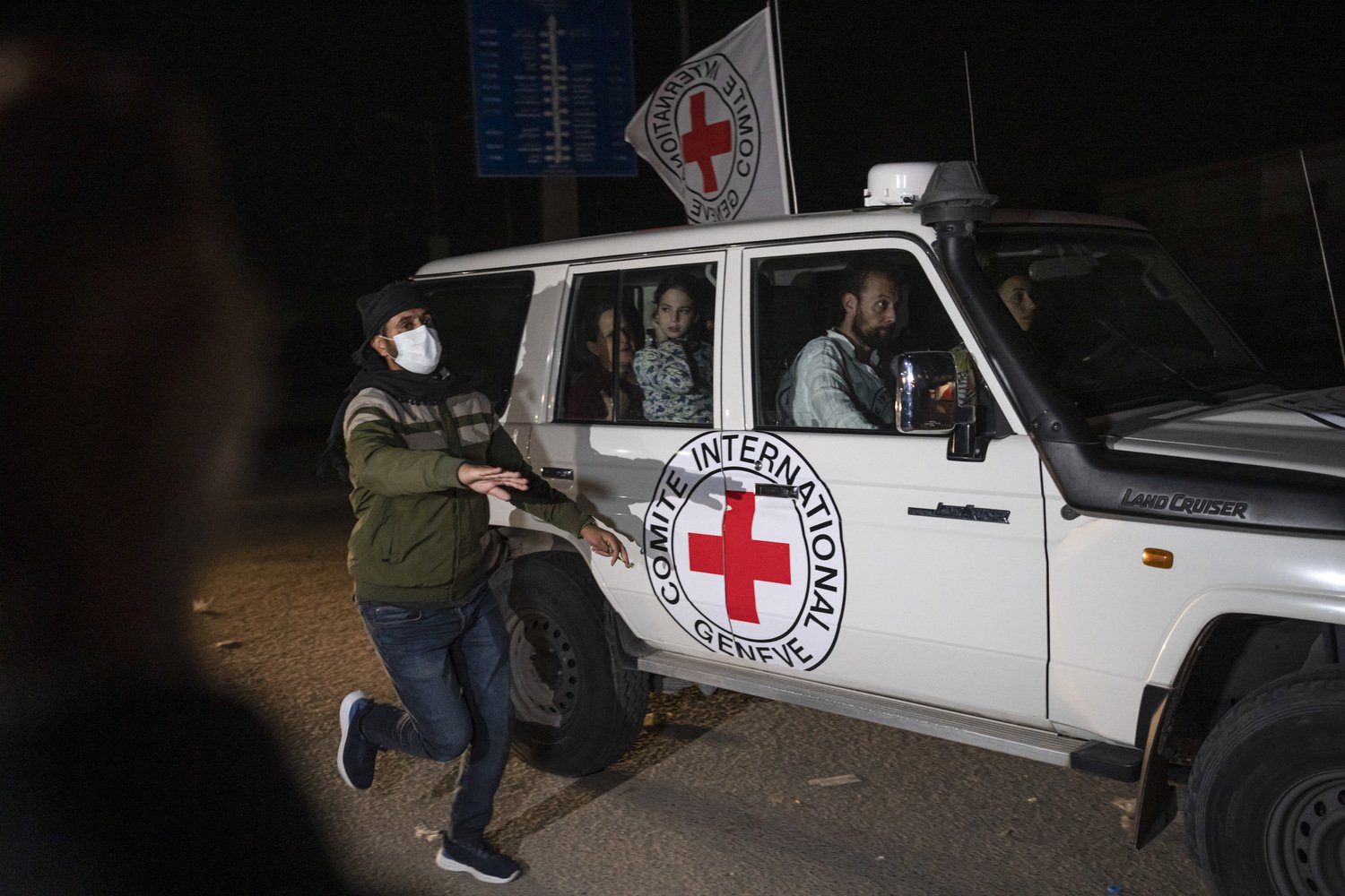  A Red Cross vehicle carrying Israeli hostages drives by at the Gaza Strip crossing into Egypt in Rafah on Saturday, Nov. 25, 2023. Photo by Fatima Shbair 