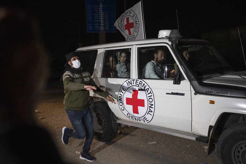  A Red Cross vehicle carrying Israeli hostages drives by at the Gaza Strip crossing into Egypt in Rafah on Saturday, Nov. 25, 2023. Photo by Fatima Shbair 