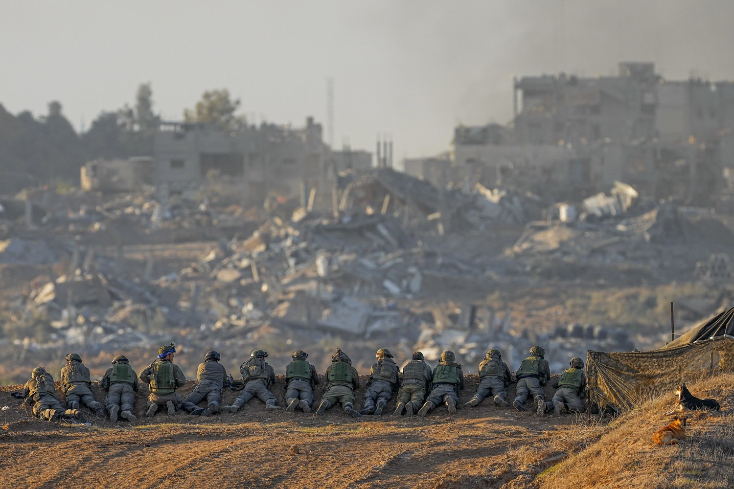  Israeli soldiers take positions near the Gaza Strip border, in southern Israel, Monday, Dec. 11, 2023. The army is battling Palestinian militants across Gaza in the war ignited by Hamas' Oct. 7 attack into Israel. Photo by Ohad Zwigenberg 