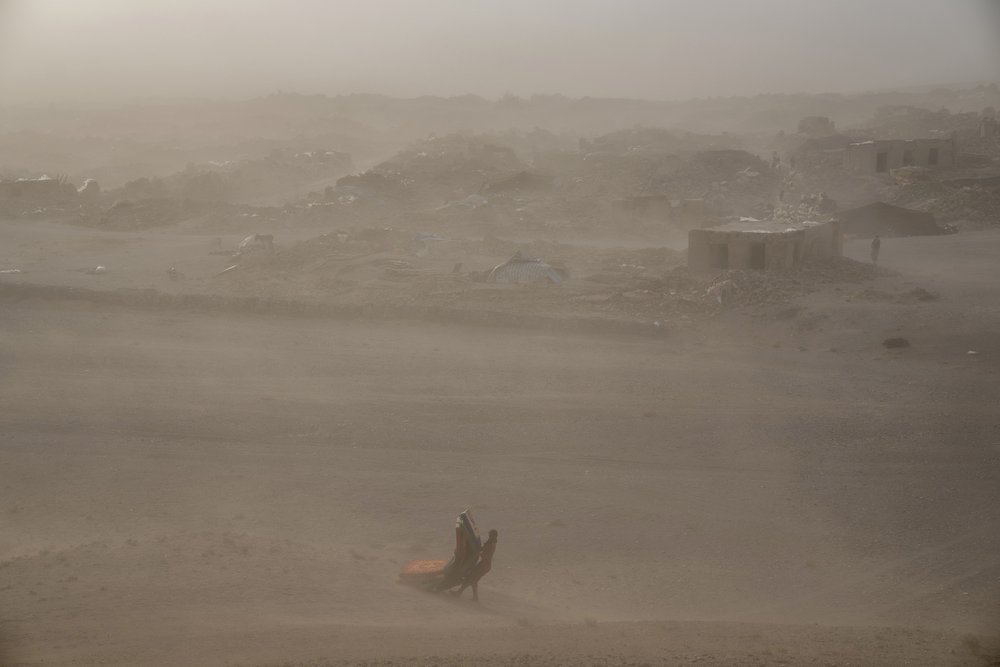  An Afghan girl carries donated aid to her tent, after an earthquake in Zenda Jan district in Herat province, western of Afghanistan, Thursday, Oct. 12, 2023. Another strong earthquake shook western Afghanistan on Wednesday morning after an earlier o