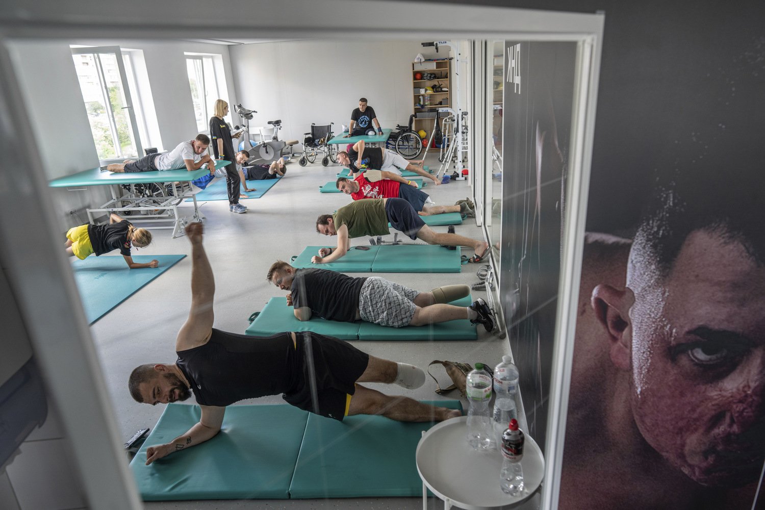  Ukrainian army veterans with amputated limbs take part in group rehabilitation exercises at the Unbroken rehabilitation center in Lviv, Ukraine, Monday, July 24, 2023. Ukraine is facing the prospect of a future with upwards of 20,000 amputees, many 