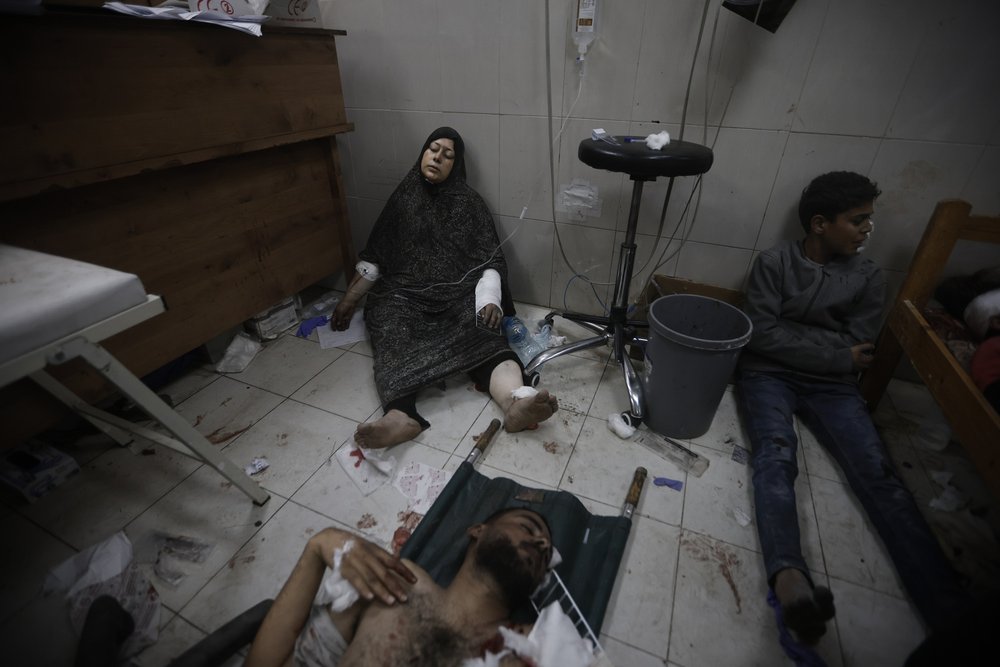  Palestinians wounded in the Israeli bombardment of the Gaza Strip arrive at a hospital in Khan Younis on Friday, Dec. 8, 2023.  