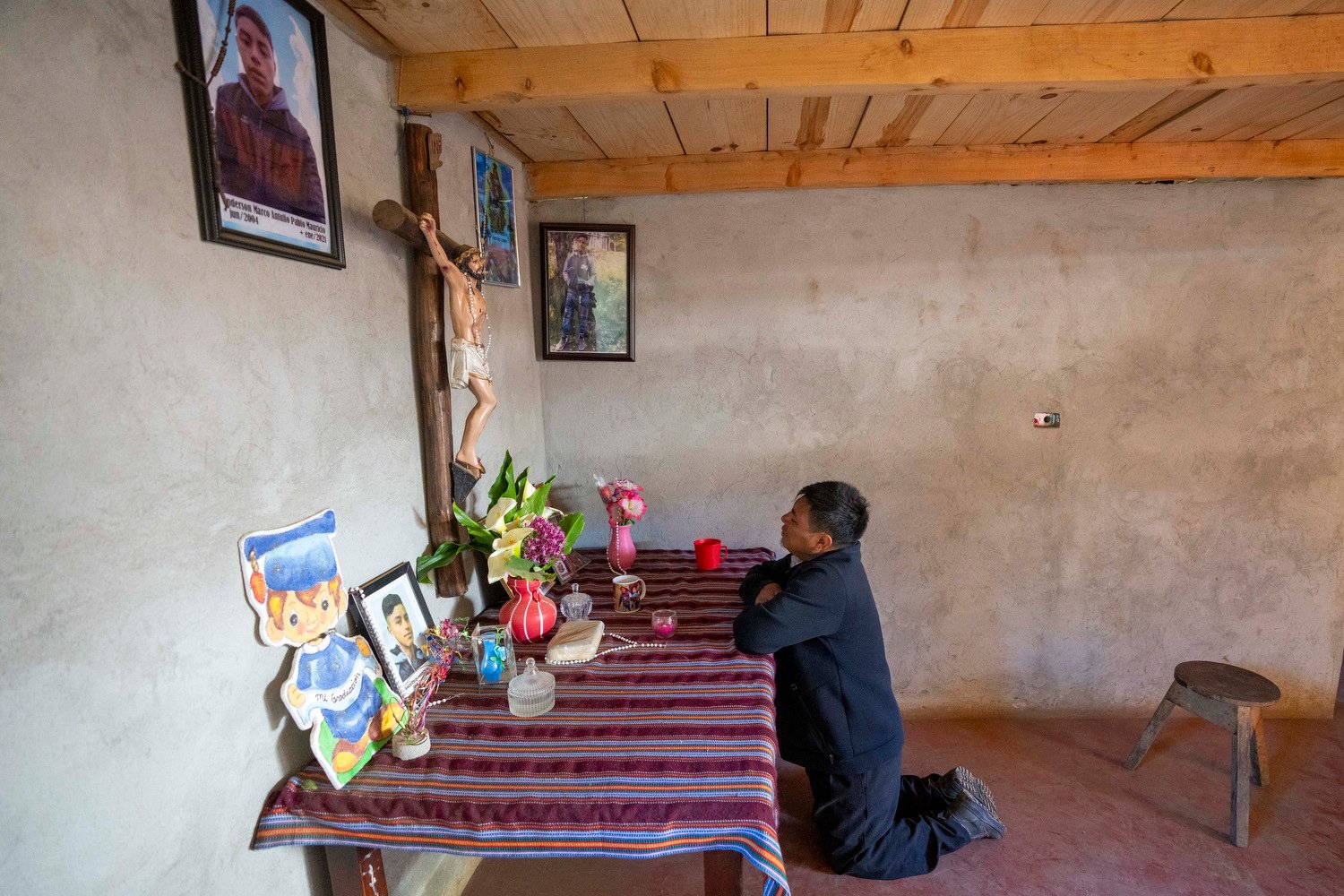  Marco Antulio Pablo Perez prays at an altar for his son Anderson Pablo who died trying to migrate to the U.S. in Comitancillo, Guatemala, March 20, 2024. The 16-year-old died among the migrants who were shot and set afire by rogue police officers in