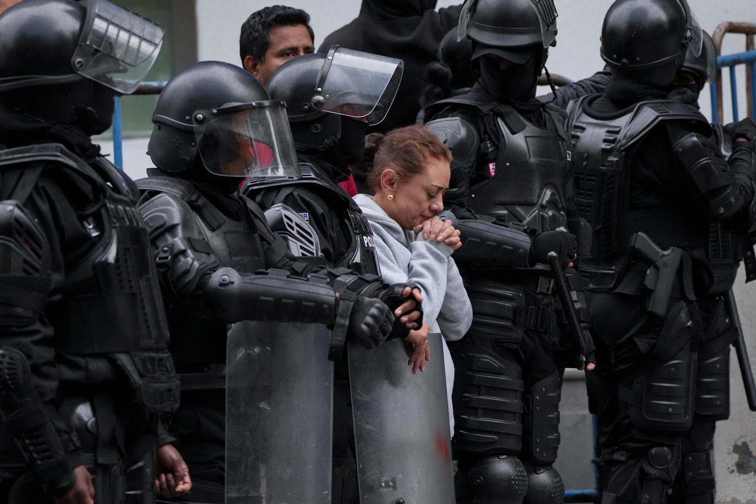  A supporter of former Ecuadorian Vice President Jorge Glas stands outside the detention center where he was taken after police broke into the Mexican Embassy to arrest him, in Quito, Ecuador, April 6, 2024. Glas took refuge in the Mexican embassy in