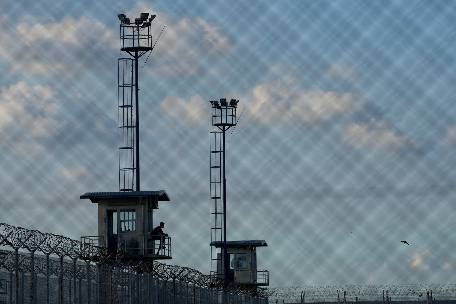  A prison guard sits in a watchtower at the Pinero jail in Pinero, Argentina, April 9, 2024. President Javier Milei has called for harsher penalties against drug traffickers and military intervention. (AP Photo/Natacha Pisarenko) 