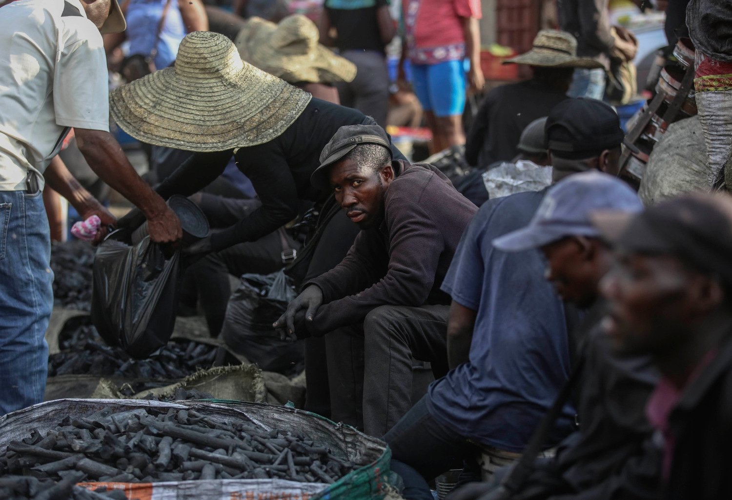  A man sells coal in the Petion-Ville neighborhood of Port-au-Prince, Haiti, April 10, 2024. (AP Photo/Odelyn Joseph) 