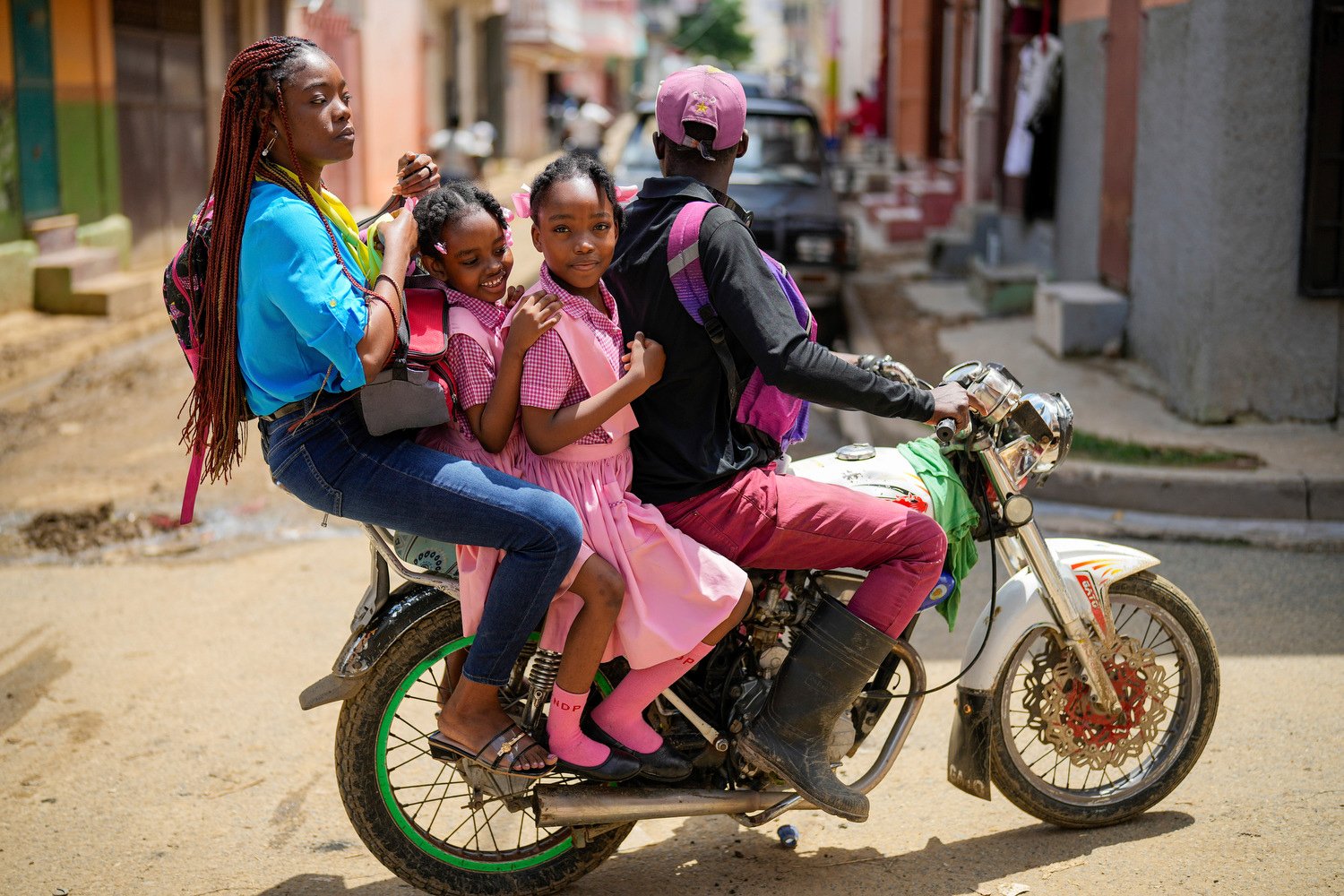  People ride on a motorcycle in Cap-Haitien, Haiti, April 17, 2024. (AP Photo/Ramon Espinosa) 