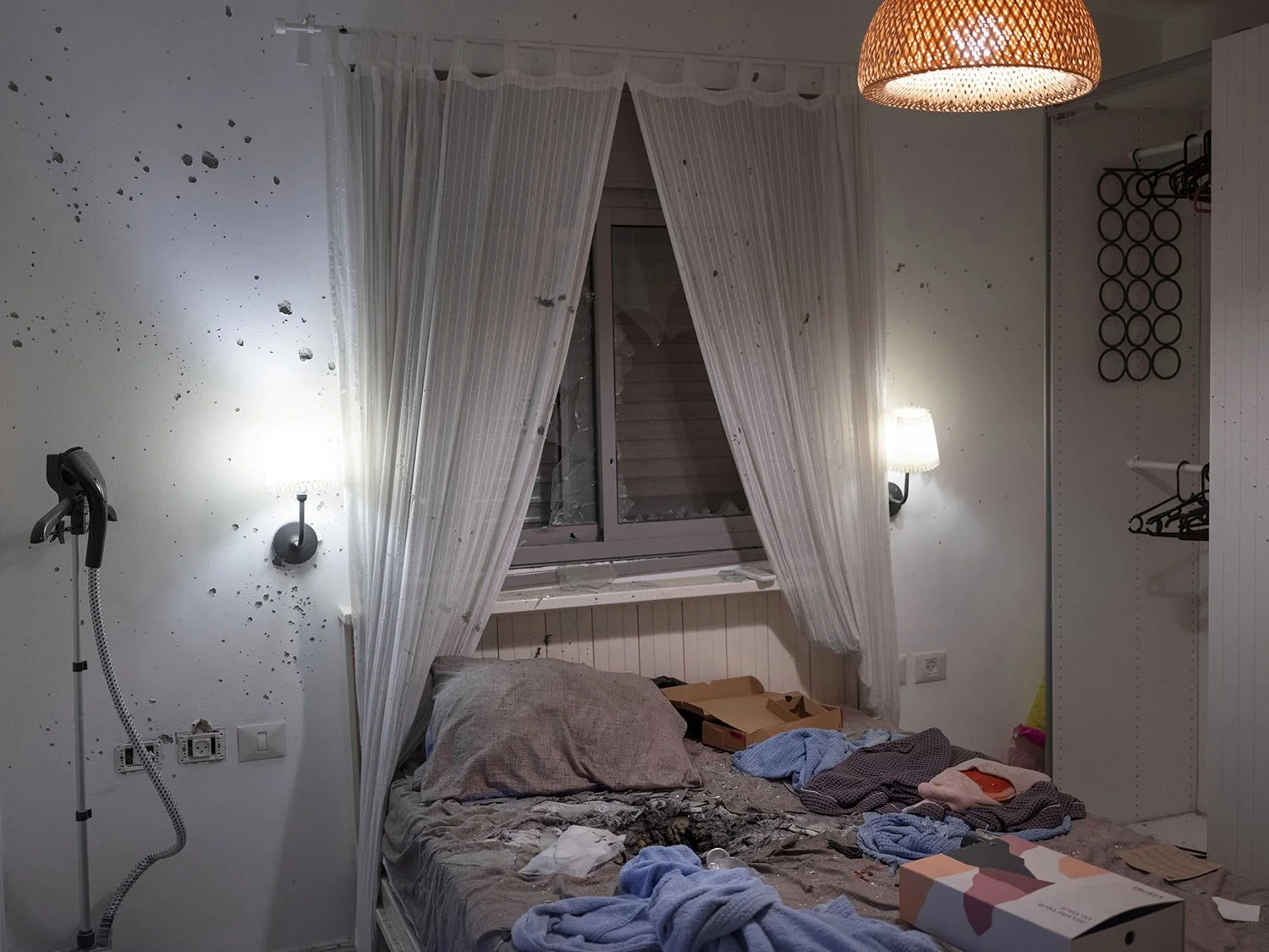  Damage from a hand grenade seen in the bedroom of hostage Sagui Dekel-Chen, 35, in Kibbutz Nir Oz, Israel, on Thursday, May 30, 2024. (AP Photo/Oded Balilty) 