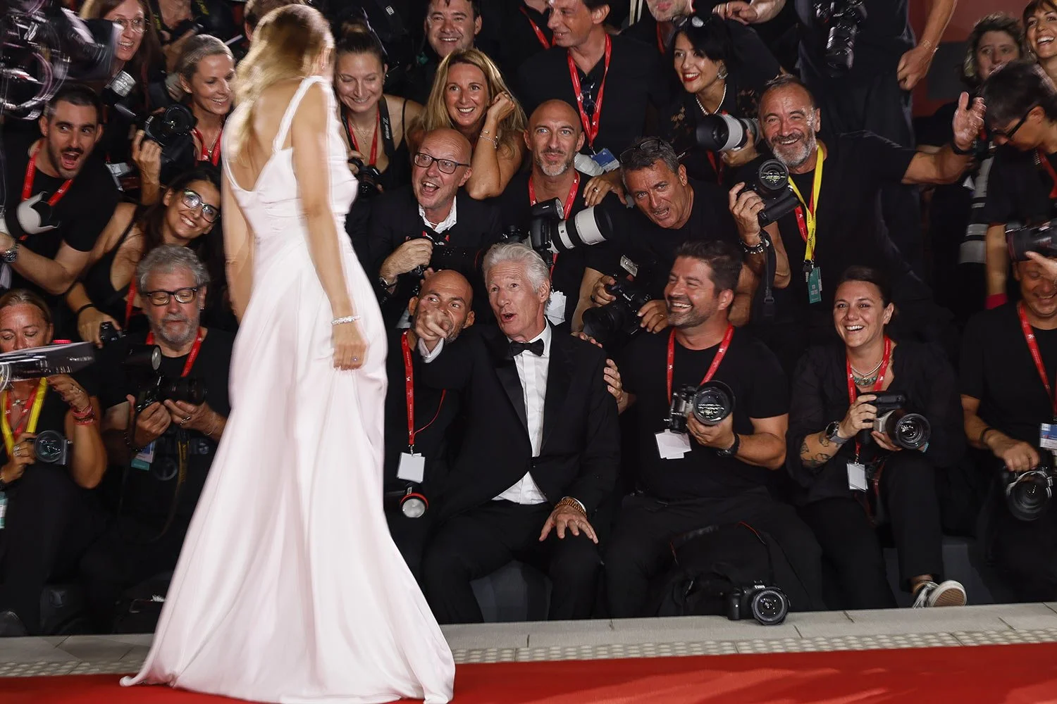 Richard Gere, center, sits with the photographers upon arrival for the premiere of the film “Wolfs" during the 81st edition of the Venice Film Festival in Venice, Italy, on Sunday, Sept. 1, 2024. (Photo by Joel C Ryan/Invision/AP)