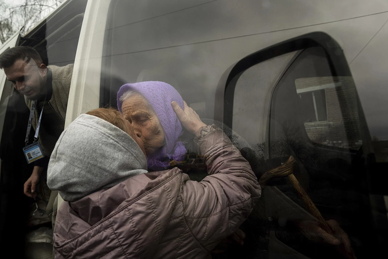  Olha Faichuk, 79, kisses her neighbor as she is evacuated from her home, which was heavily damaged by a Russian airstrike in Lukiantsi, Kharkiv region, Ukraine, on Tuesday, April 16, 2024. (AP Photo/Evgeniy Maloletka) 