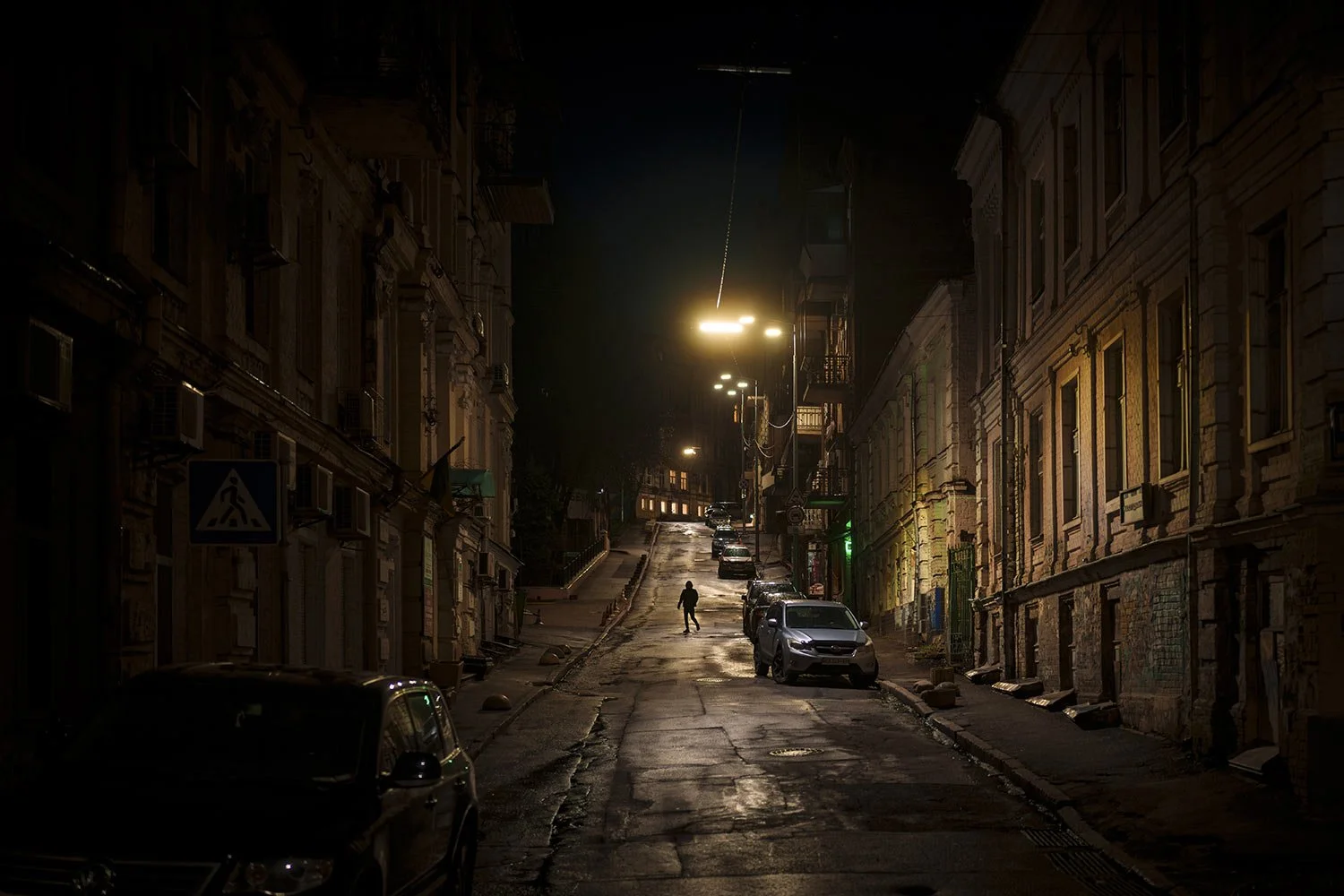  A man crosses a street downtown Kyiv, Ukraine, Tuesday, April 2, 2024. (AP Photo/Vadim Ghirda) 