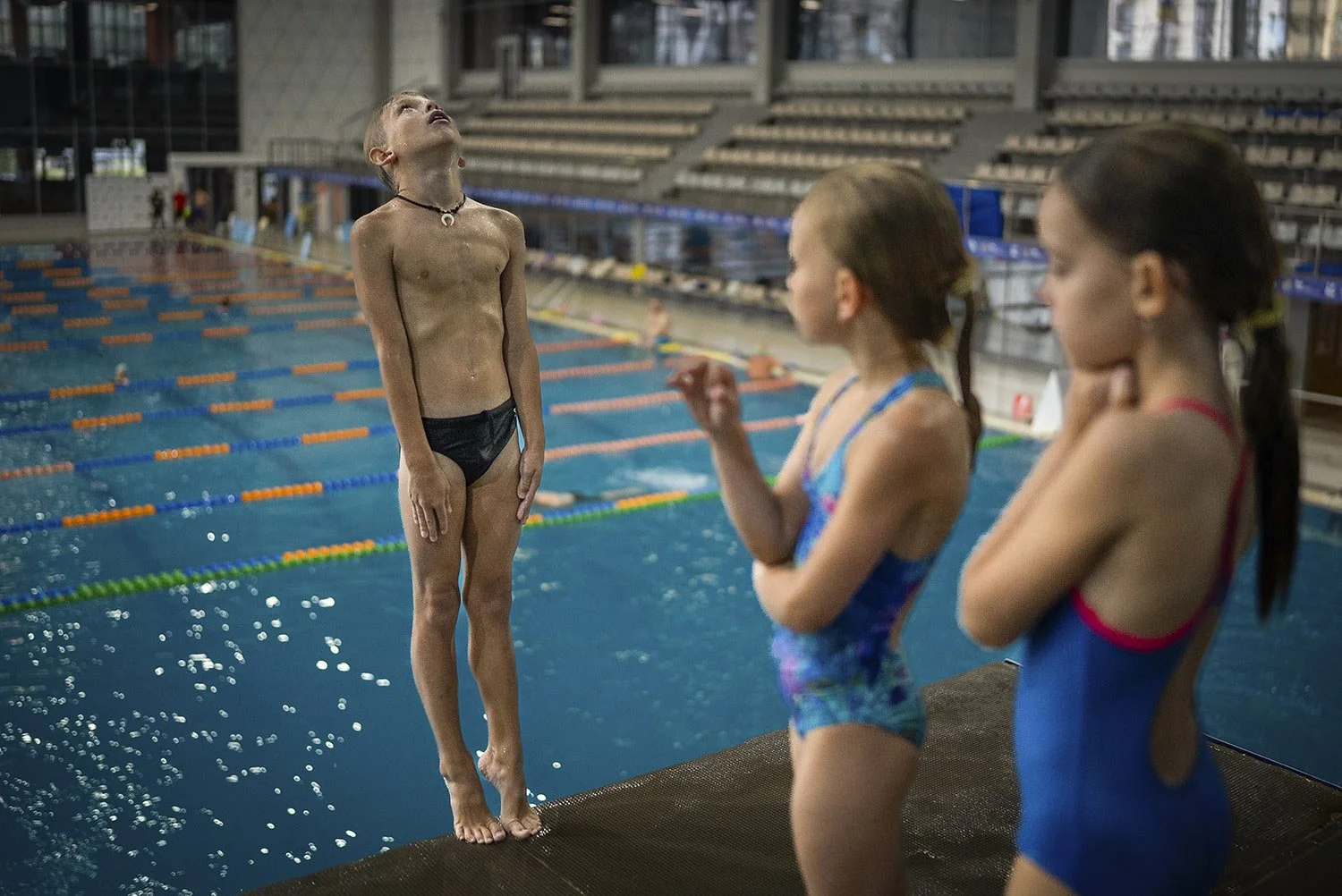  A boy dives into the water during training in Kyiv's Liko Diving School, Wednesday, July 3, 2024. (AP Photo/Alex Babenko) 
