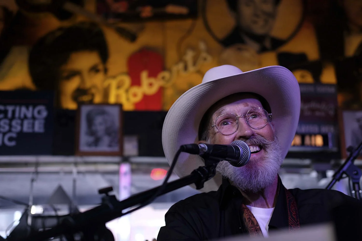  The Rev. Ron Blakely smiles on stage during the Sunday Gospel Hour that he leads at Robert's Western World honky tonk on Sunday, July 28, 2024, in Nashville, Tenn. (AP Photo/Luis Andres Henao) 