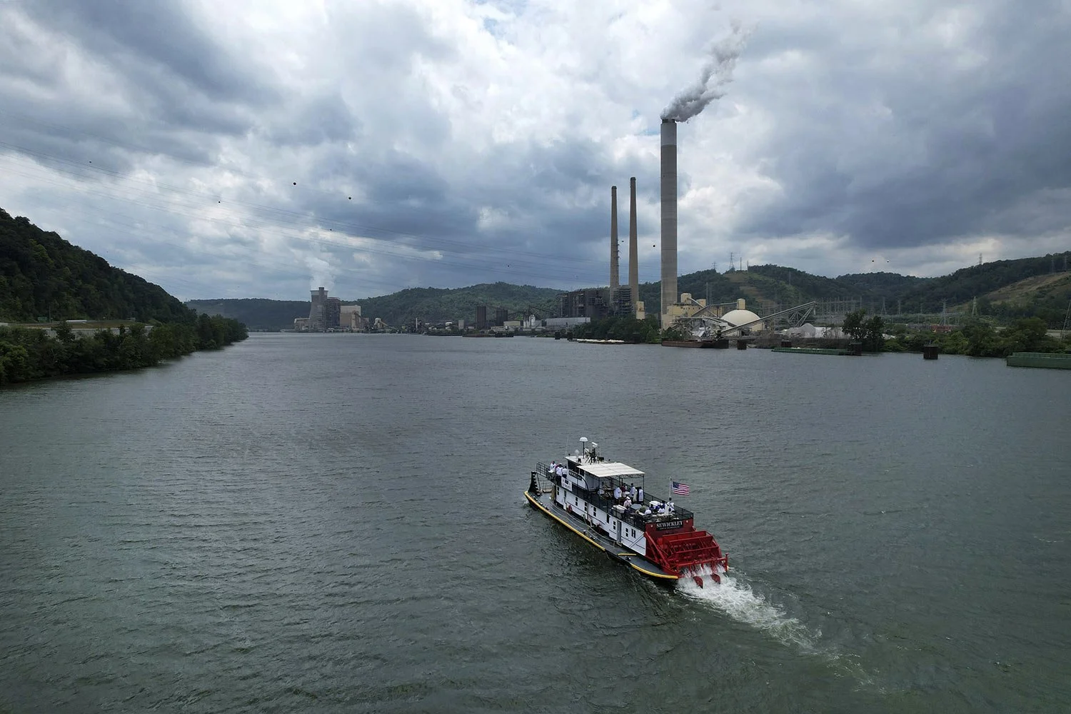 A riverboat carrying the Eucharist cruises down the Ohio River between Wellsburg, West Virginia, and Brilliant, Ohio, Sunday, June 23, 2024. The voyage is part of a two-month series of cross-country pilgrimages focused on the Eucharist, seeking to r