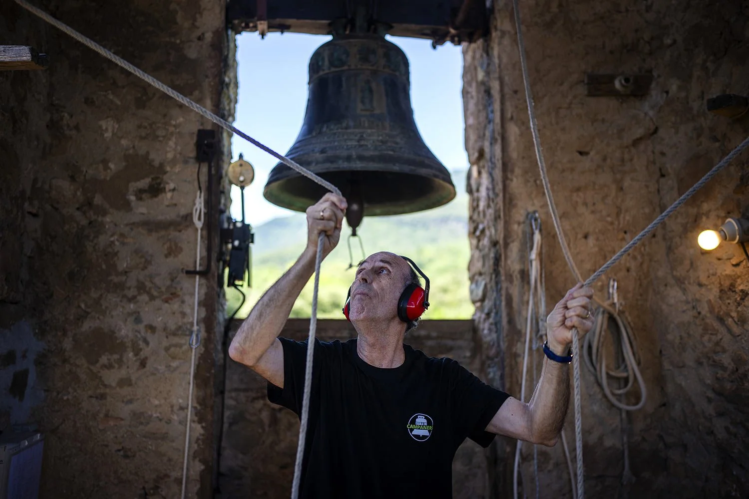  Josep-Maria Grosset, a student of the Vall d'en Bas School of Bell Ringers, performs playing two bronze bells at the church bell tower of the12th-century Sant Romà church, at the tiny village of Joanetes, about two hours north of Barcelona, Spain, S