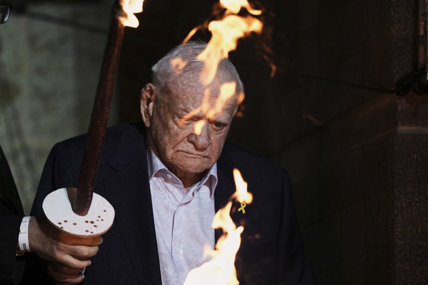 Holocaust survivor Arie Durst lights a torch during the opening ceremony of the Holocaust Remembrance Day at the Yad Vashem Holocaust Memorial Museum in Jerusalem on Wednesday, April 23, 2025. (AP Photo/Leo Correa)
