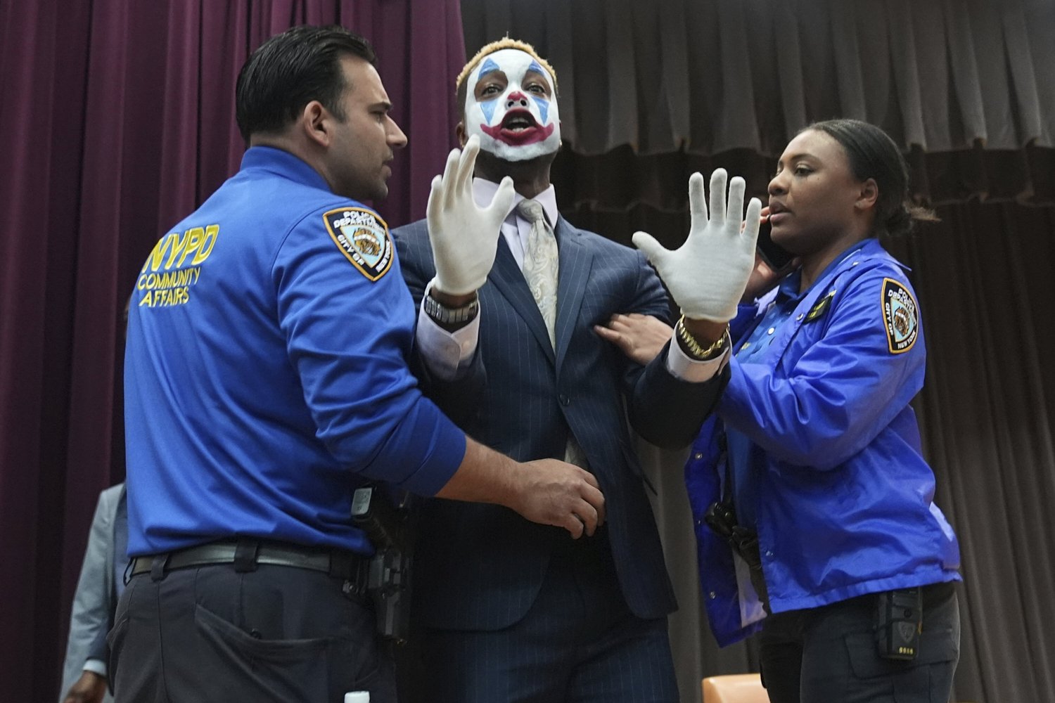 Paperboy Prince is removed from the New York City Mayoral Candidates Forum at Medgar Evers College Wednesday, April 23, 2025, in New York. (AP Photo/Frank Franklin II)