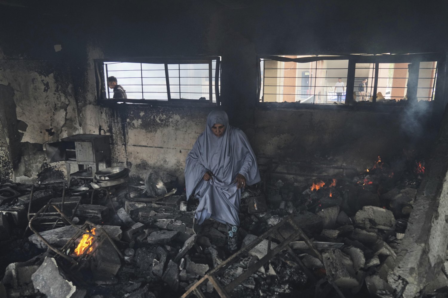 Palestinians inspect the damage after an Israeli army airstrike on Yaffa School, in Gaza City, Wednesday, April 23, 2025. (AP Photo/Jehad Alshrafi)