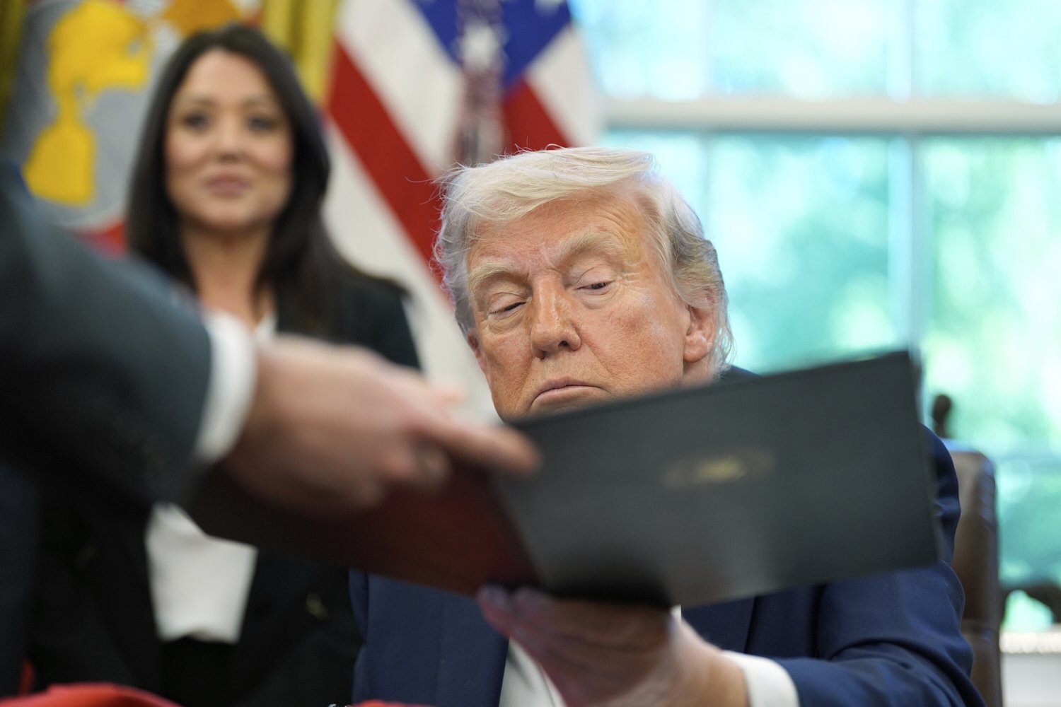 President Donald Trump prepares to sign an executive order regarding education in the Oval Office of the White House, Wednesday, April 23, 2025, in Washington. (AP Photo/Alex Brandon)