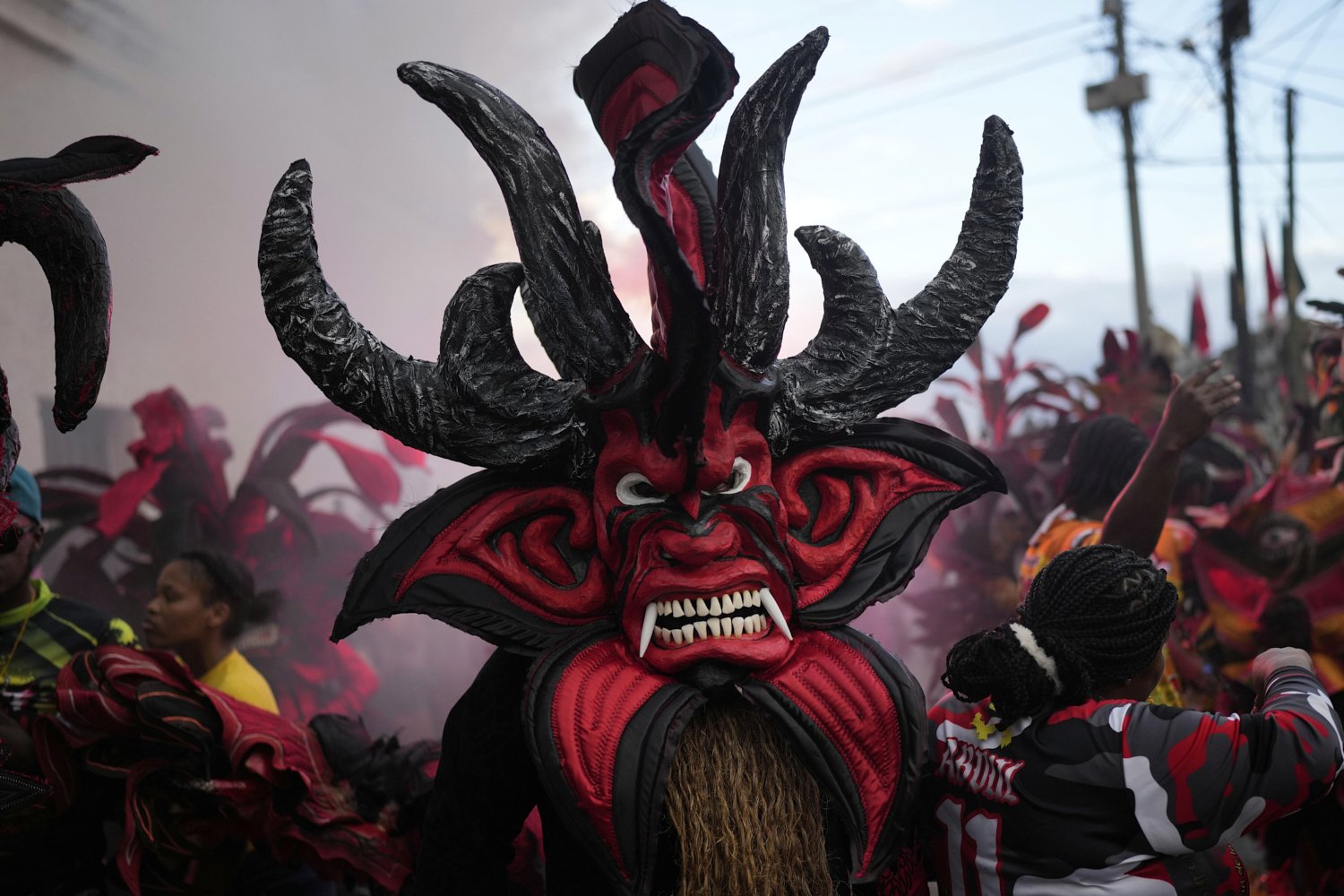 Revelers take part in the Devils and Congos Festival in Portobelo, Panama, Saturday, May 3, 2025. (AP Photo/Matias Delacroix)