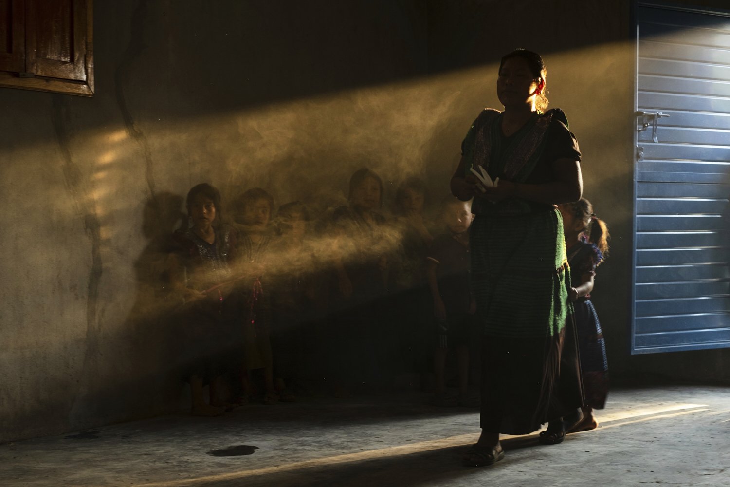 Congregants attend an Indigenous blessing ceremony for Communion wafers that will be taken to a priest to be consecrated before they can be given out, in Nuevo Israelita, near Simojovel, Mexico, Saturday, April 26, 2025. (AP Photo/Isabel Mateos)