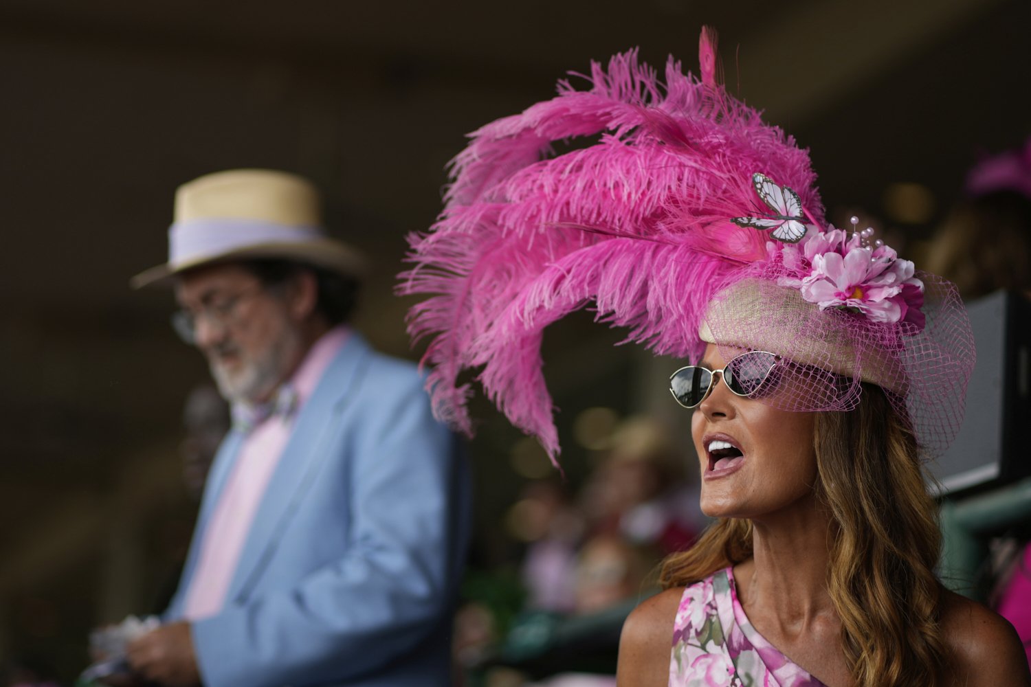 A race fan sits in the stands at Churchill Downs before the 151st running of the Kentucky Oaks horse race Friday, May 2, 2025, in Louisville, Ky. (AP Photo/Charlie Riedel)