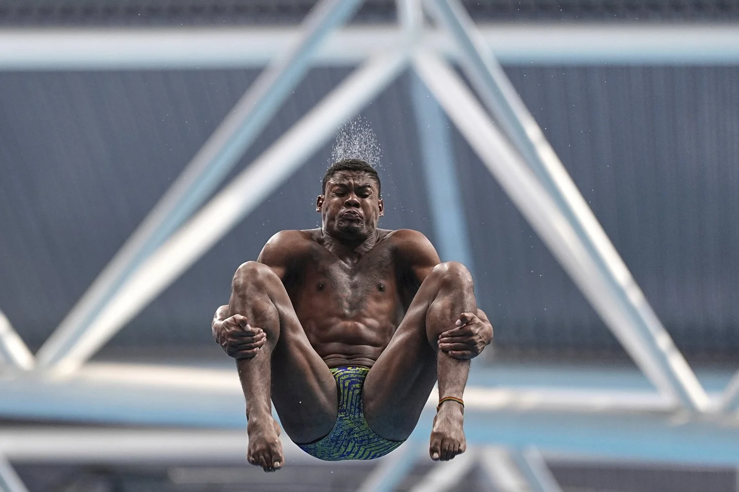 Luis Felipe Bonfim Dos Santos Moura of Brazil competes in the mixed 3m and 10m team diving final at the World Aquatics Championships in Singapore, Saturday, July 26, 2025. (AP Photo/Ng Han Guan)