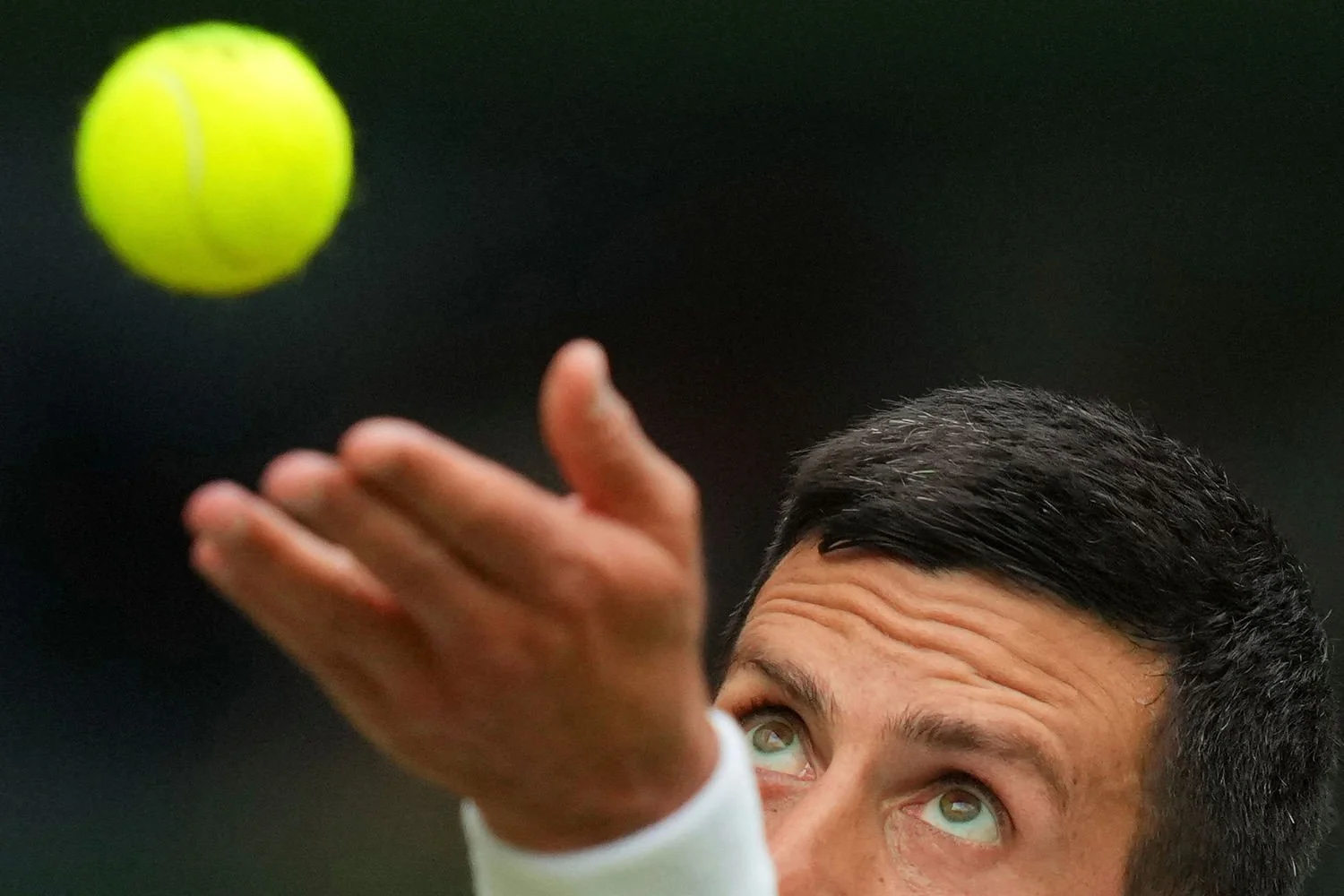 Novak Djokovic serves to Miomir Kecmanovic, both from Serbia, during a third round men's singles match at the Wimbledon Tennis Championships in London, July 5, 2025. (AP Photo/Kirsty Wigglesworth)