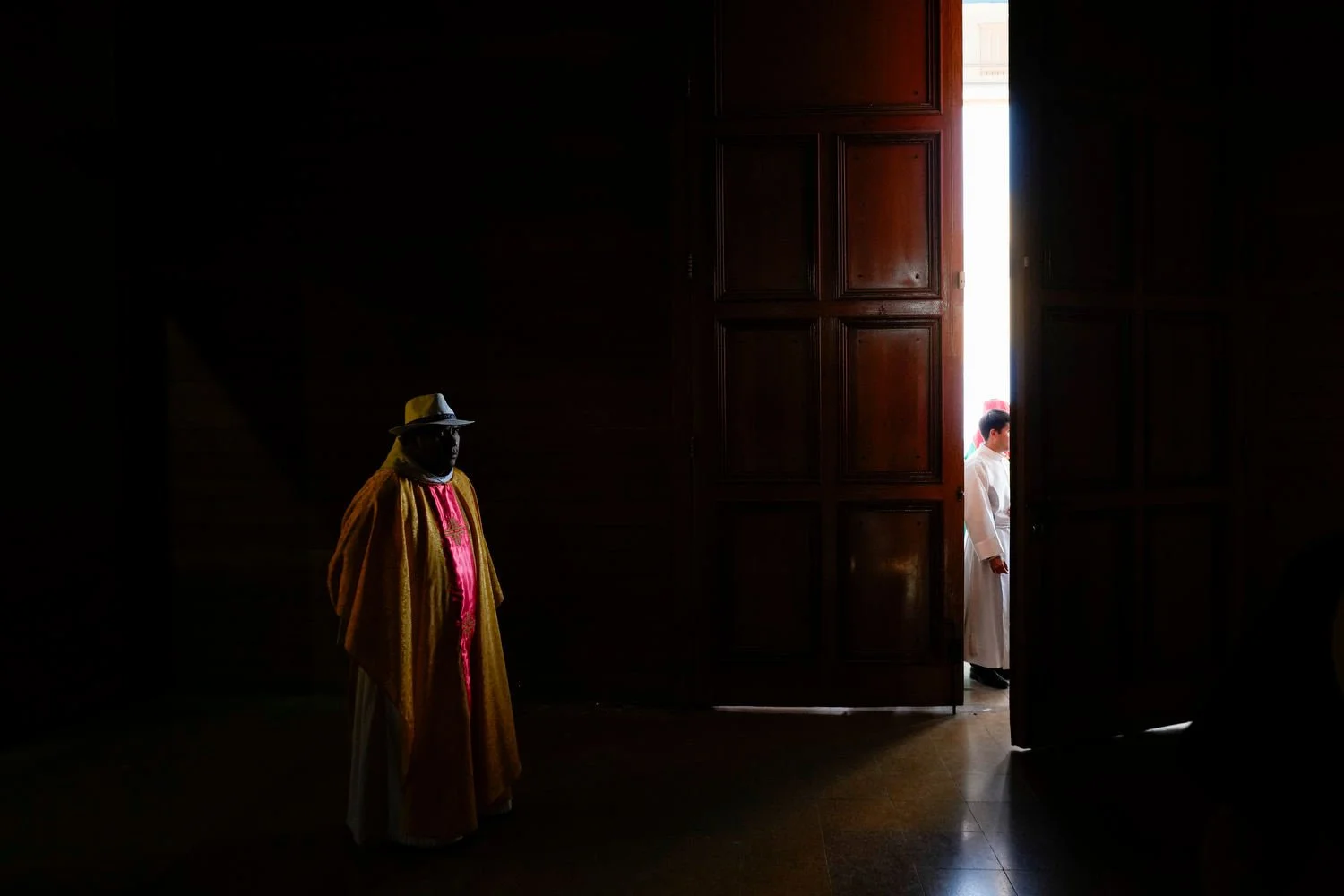 A priest attends a celebration of Chile's patron saint, Our Lady of Mount Carmel, in La Tirana, Chile, July 16, 2025. (AP Photo/Esteban Felix)