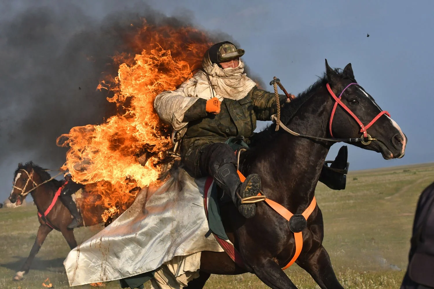 Participants of The Gallops' 2025 competition show off their skills near the alpine Song-Kol Lake in Kyrgyzstan, July 21, 2025. (AP Photo/Vladimir Voronin)