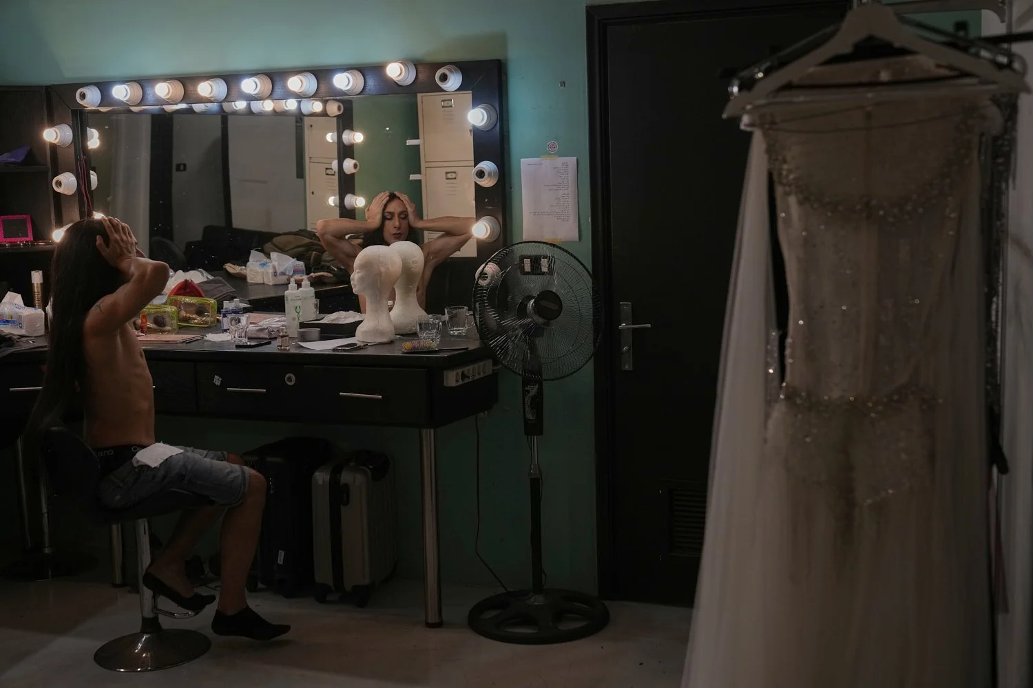 Alexandre Paulikevitch gets ready backstage before performing at a popular theatre in Beirut, Lebanon, Thursday, Sept. 11, 2025. (AP Photo/Hussein Malla)