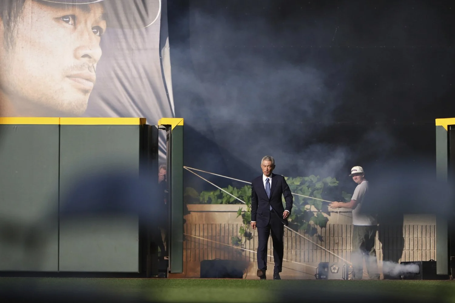 Former Seattle Mariners right fielder Ichiro Suzuki walks on to the field for his jersey retirement ceremony in Seattle, Aug. 9, 2025, before a baseball game between the Mariners and the Tampa Bay Rays. (AP Photo/Lindsey Wasson)
