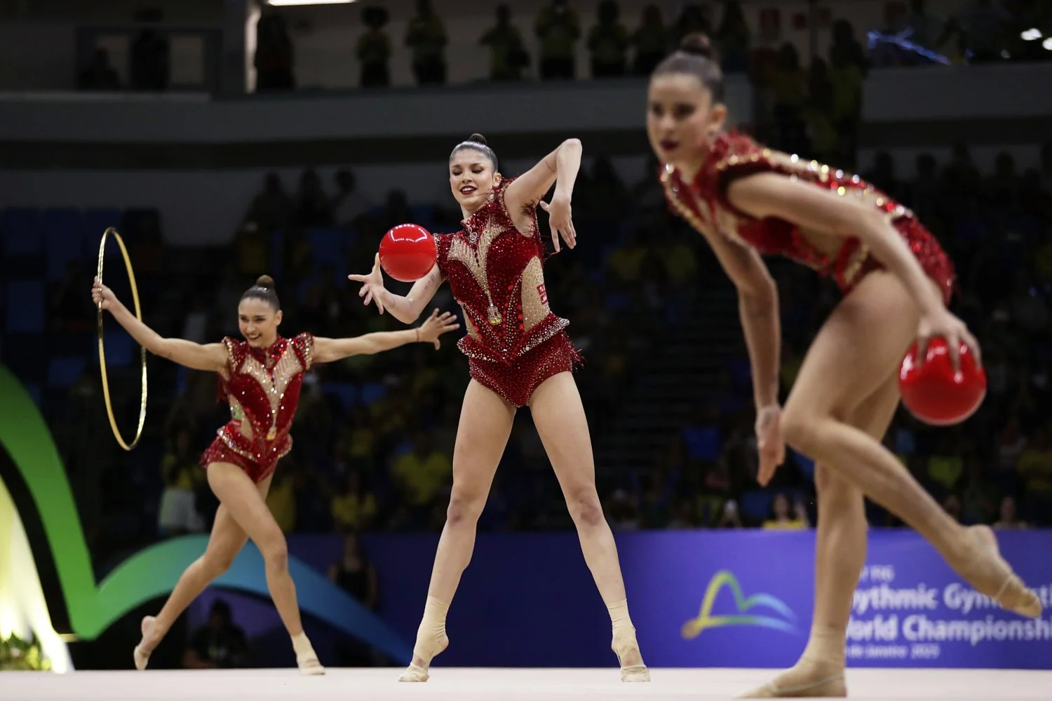 Brazil's team competes with hoops and balls during the group all-around final at the 41st FIG Rhythmic Gymnastics World Championships in Rio de Janeiro, Aug. 23, 2025. (AP Photo/Bruna Prado)