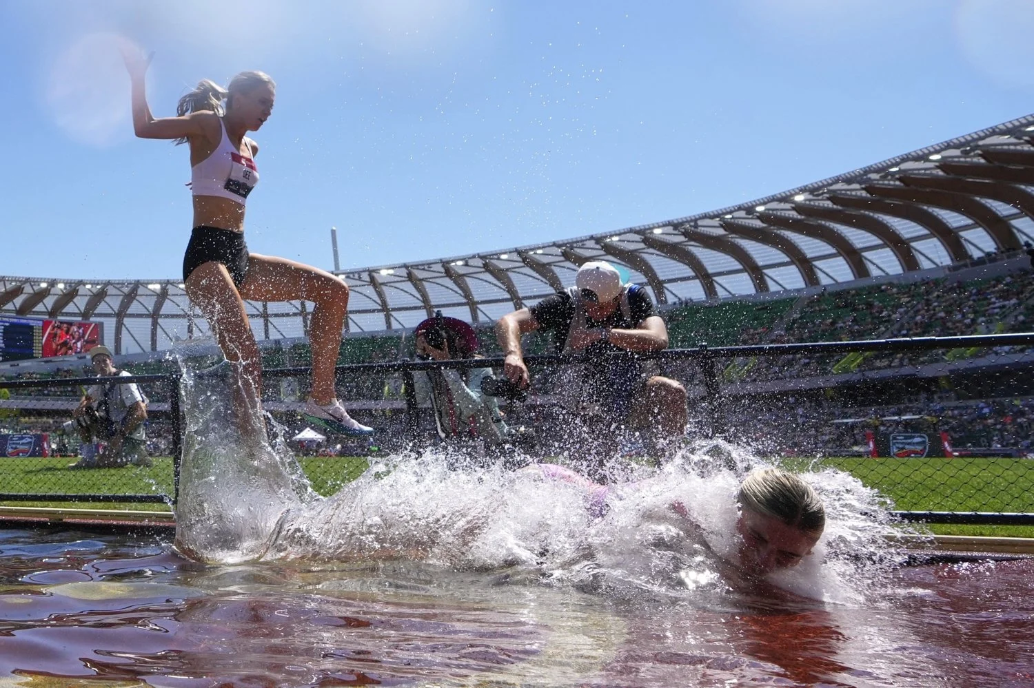 Gracie Hyde stumbles as she competes in the women's 3000-meter steeplechase finals during the U.S. Championships athletics meet in Eugene, Oregon, Aug. 2, 2025. (AP Photo/Ashley Landis)
