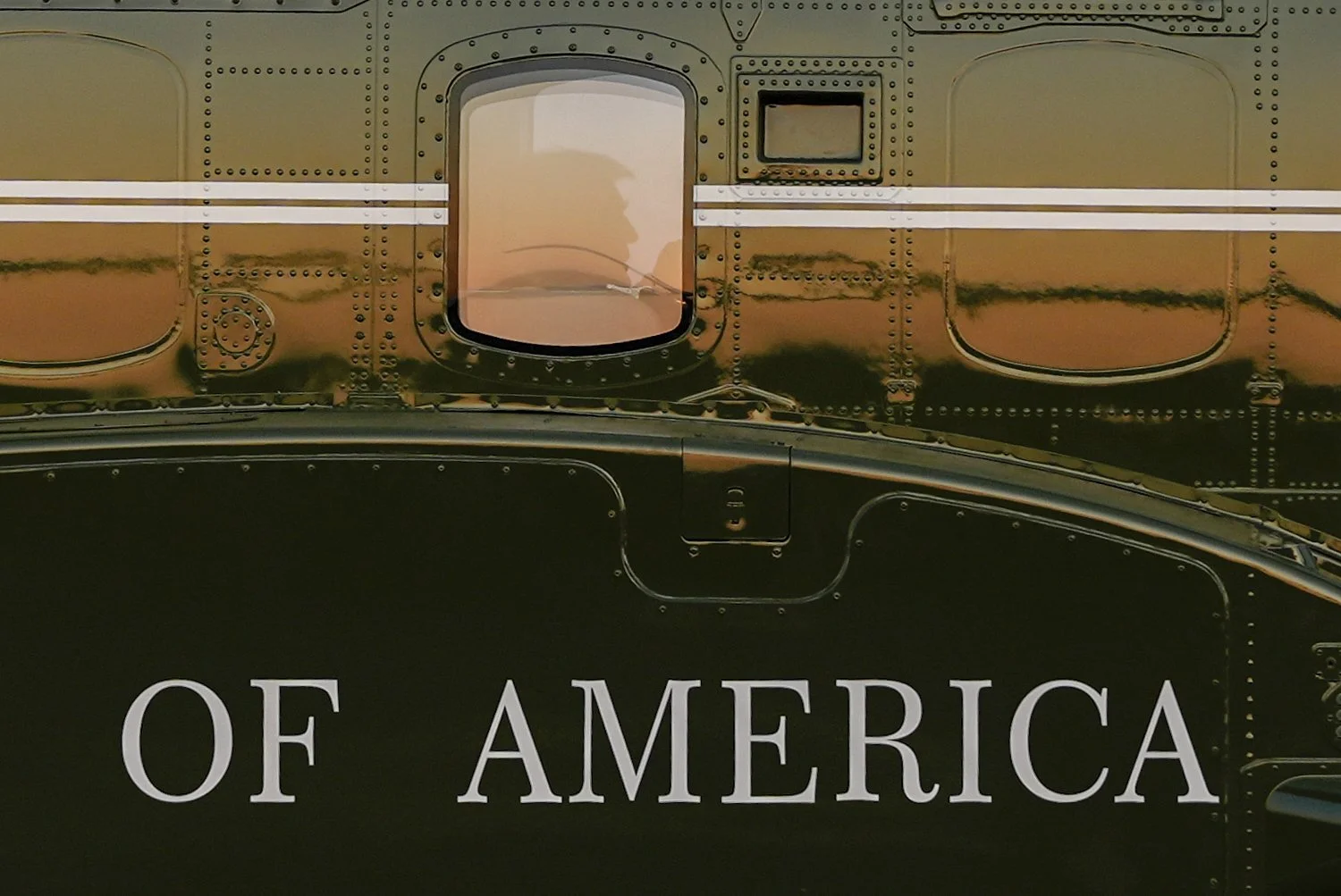 U.S. President Donald Trump is seen in the window of Marine One at Lehigh Valley International Airport in Allentown, Pennsylvania, Aug. 3, 2025. (AP Photo/Julia Demaree Nikhinson)