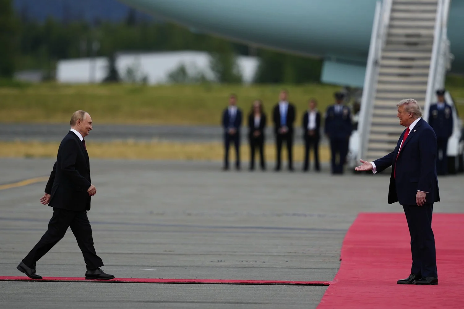 U.S. President Donald Trump greets Russia's President Vladimir Puti at Joint Base Elmendorf-Richardson, Alaska, Aug. 15, 2025. (AP Photo/Julia Demaree Nikhinson)