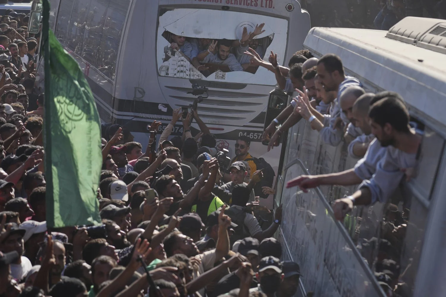  People gather to greet freed Palestinian prisoners arriving on buses in the Gaza Strip after their release from Israeli jails under a ceasefire agreement between Hamas and Israel, outside Nasser Hospital in Khan Younis, southern Gaza Strip, Oct. 13,