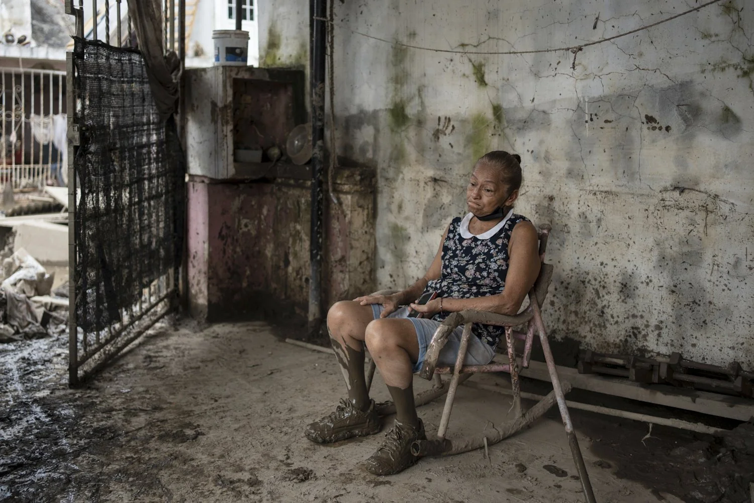  Angela Perez sits on a chair in her house in Poza Rica, Veracruz state, Mexico, Wednesday, Oct. 15, 2025, after deadly floods and torrential rain. (AP Photo/Felix Marquez) 