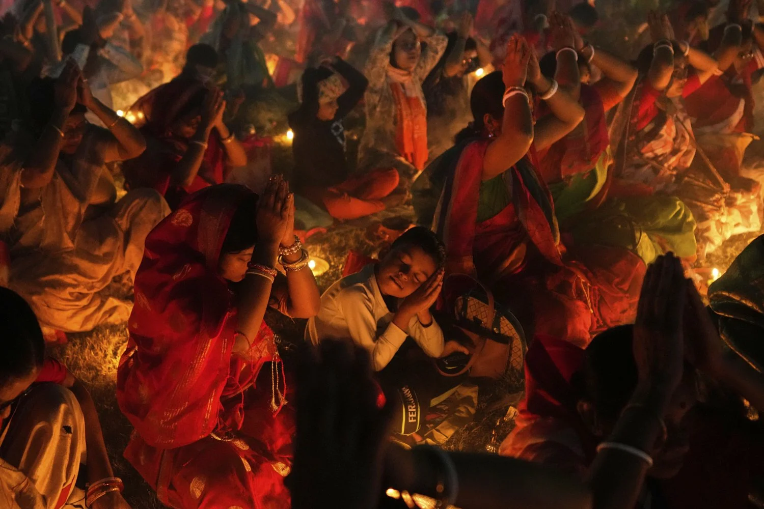  Devotees pray with lamps during a ritual of Rakher Upobash, a Hindu religious festival that involves a daylong fast and overnight prayer seeking spiritual purification, honoring Hindu saint Loknath Brahmachari, at a temple in Chakla, West Bengal, In