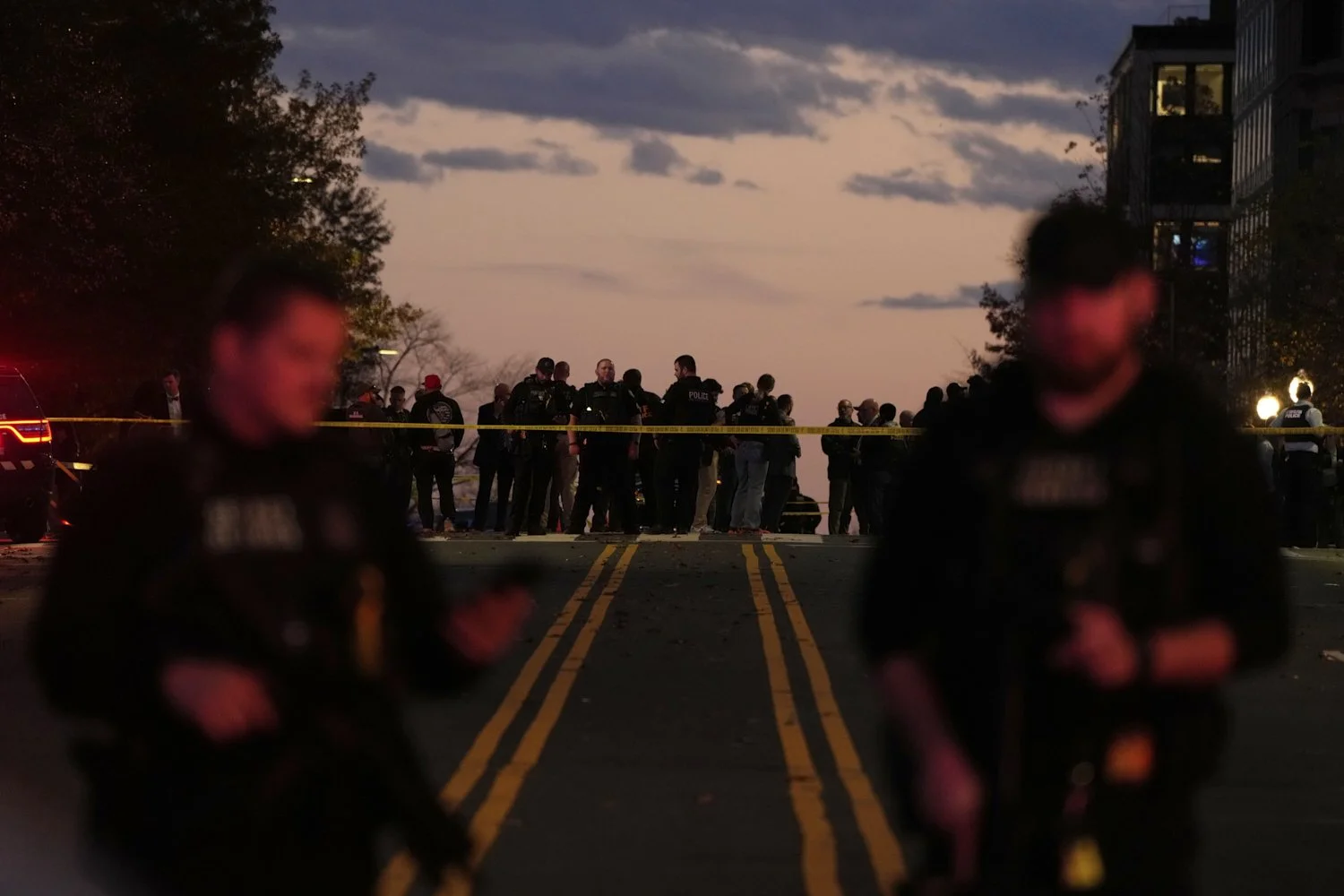  Emergency personnel keep a presence following the shooting of two National Guard soldiers near the White House, Wednesday, Nov. 26, 2025, in Washington. (AP Photo/Mark Schiefelbein) 