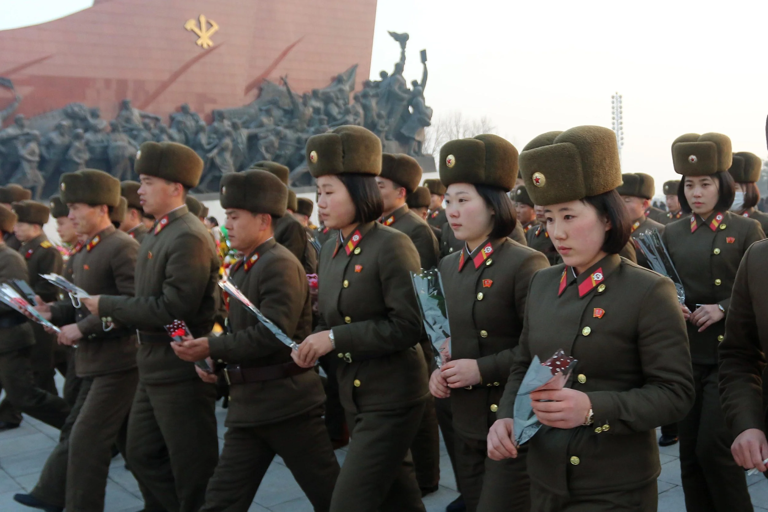  Pyongyang citizens and soldiers pay respect to the statues of President Kim Il Sung and Chairman Kim Jong Il on the 14th anniversary of Kim Jong Il's death in Pyongyang, DPRK, Dec. 17, 2025. (AP Photo/Cha Song Ho) 