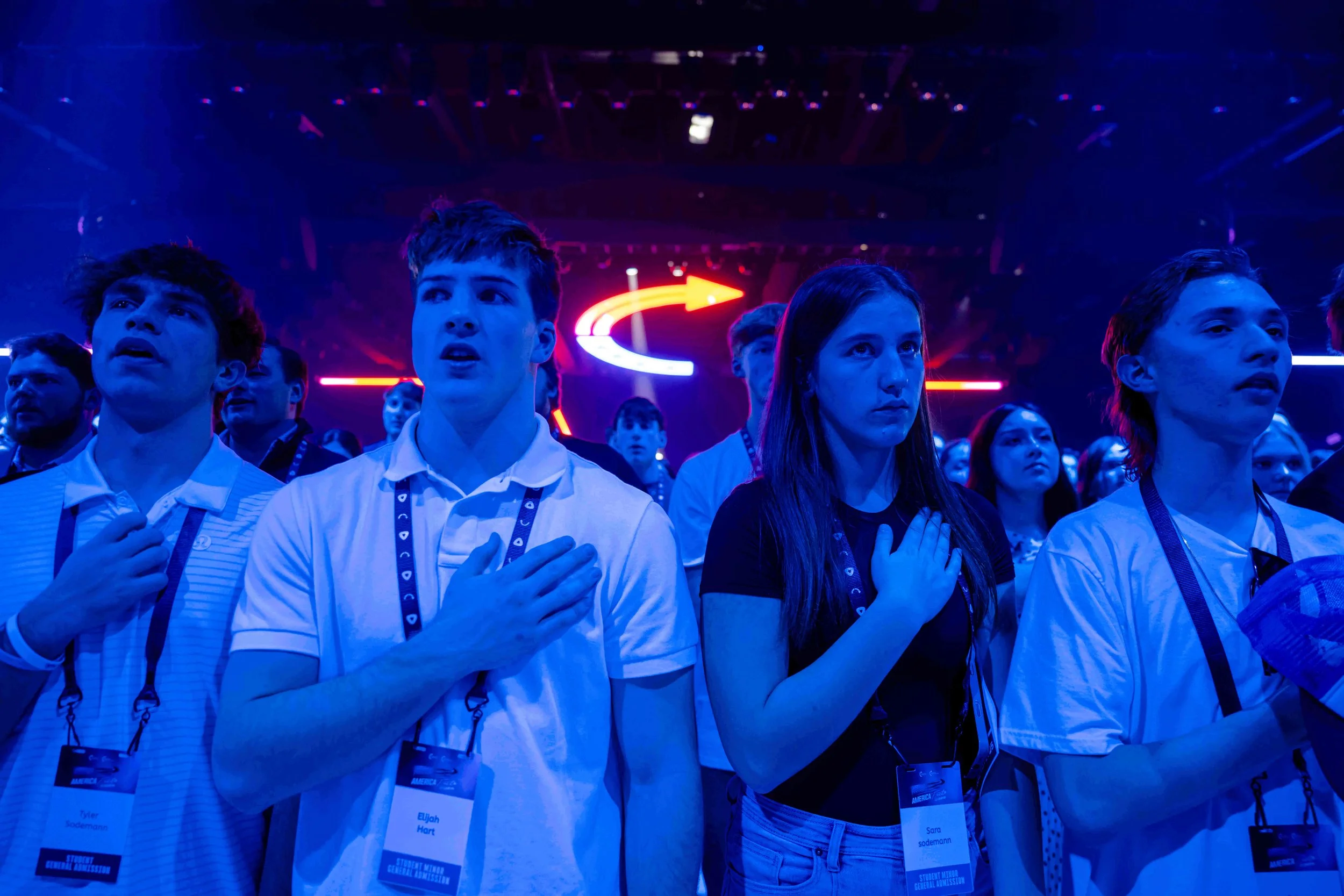  Attendees stand during Turning Point USA's AmericaFest 2025, Dec. 18, 2025, in Phoenix. (AP Photo/Jon Cherry) 