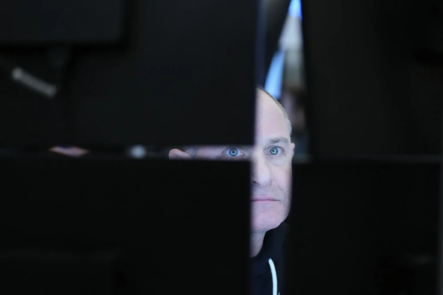  People work on the floor at the New York Stock Exchange in New York, March 18, 2026. (AP Photo/Seth Wenig) 