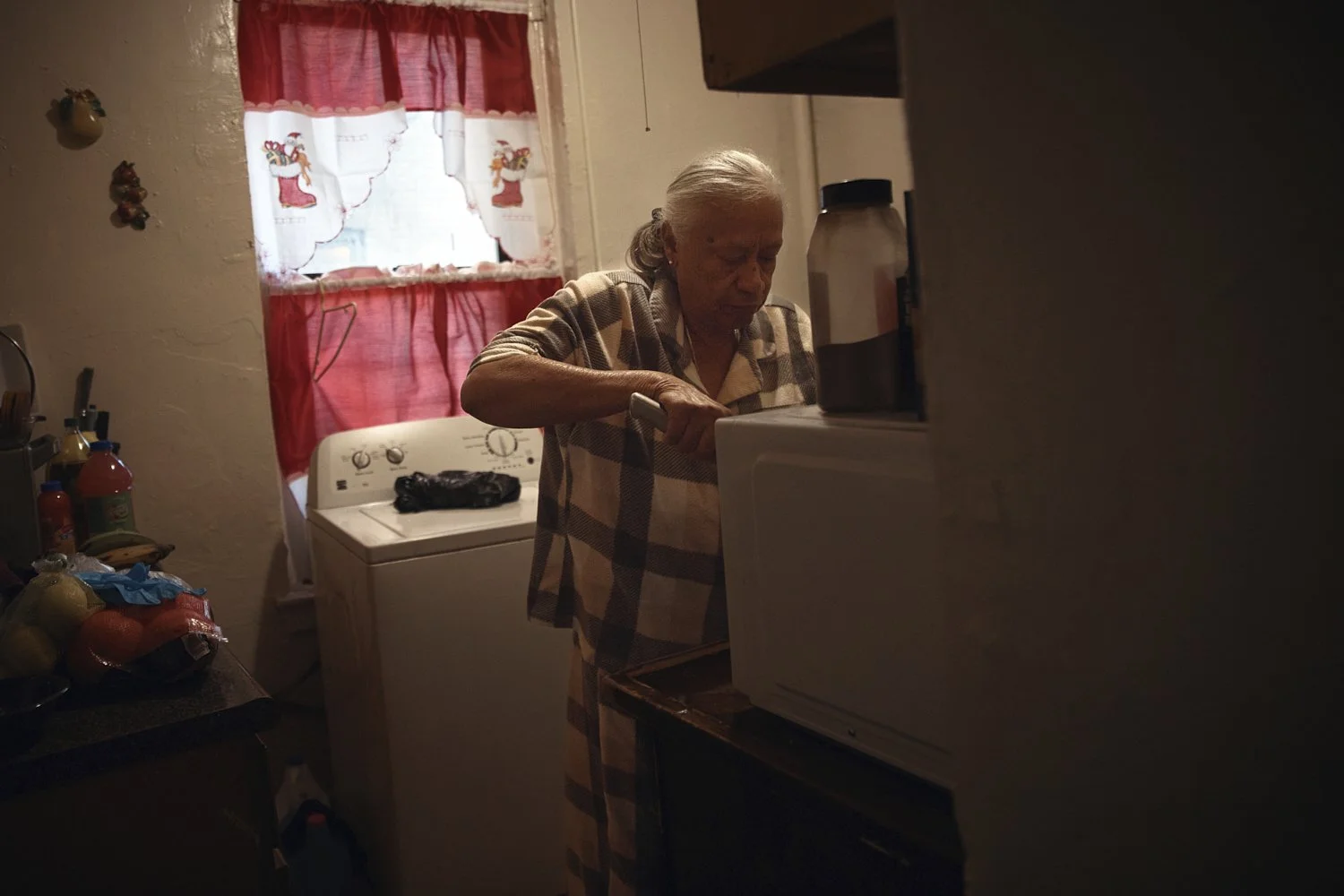  Maria Rodriguez, 73, prepares some food in a Bronx apartment building where tenants report maintenance issues, pest infestations on Tuesday, March 17, 2026, in New York. (AP Photo/Andres Kudacki) 